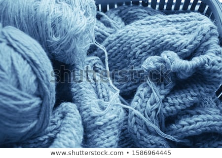 [[stock_photo]]: Blue Knitted Wooden Scarf