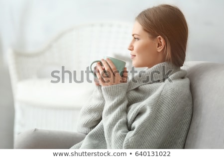 [[stock_photo]]: Beautiful Young Caucasian Woman On The Sofa With Cup Tea