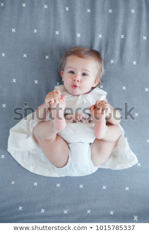 Stockfoto: One Years Girl Baby On The Bed