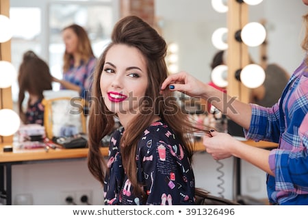 Foto stock: Beautiful Young Hairdresser In Beauty Salon