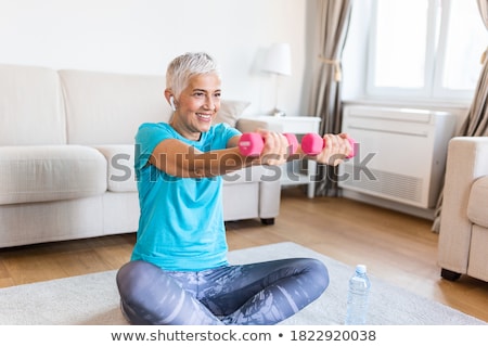 Stock fotó: Woman Doing Exercise On Pilates Ball