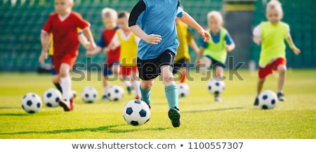 Soccer Field With Training Equipment And Players With Coach Stockfoto © matimix