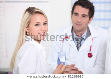Foto stock: Young Female Patient Registering Her Details