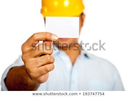 Foto stock: Young Attractive Businessman Shows His Business Card Focus In M