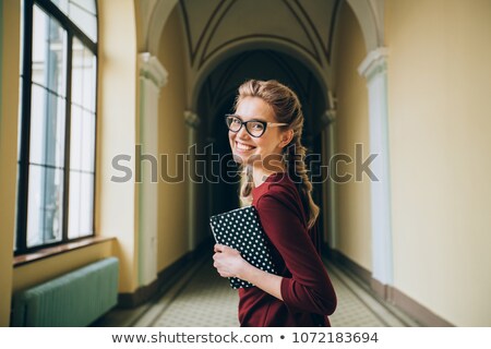 [[stock_photo]]: Young Woman Ready For Class Holding Books