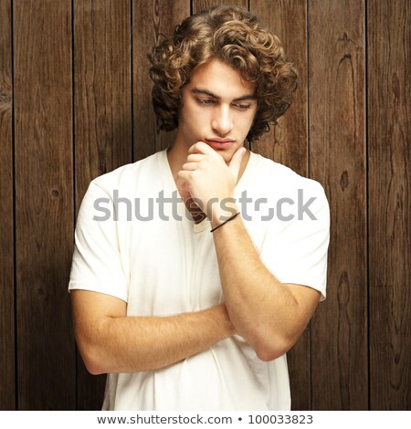 Foto stock: Thoughtful Young Man Against A White Background