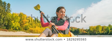 Foto stock: Tourist Kayaking In A River Quebec Canada