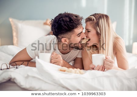 Stockfoto: Cute Couple Having Breakfast In Bed
