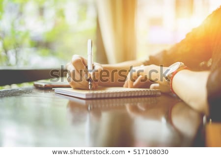 Сток-фото: Woman Writing Recipient Address On Mailing Envelope