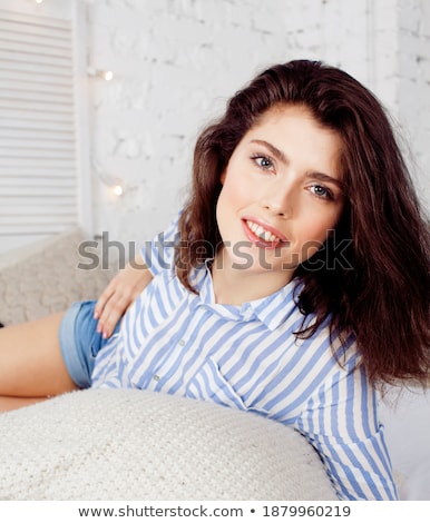 Foto stock: Young Pretty Brunette Woman In Her Bedroom Sitting At Window Happy Smiling Lifestyle People Concept