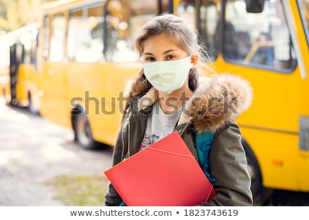 Stock photo: Young Female Student Near School Bus