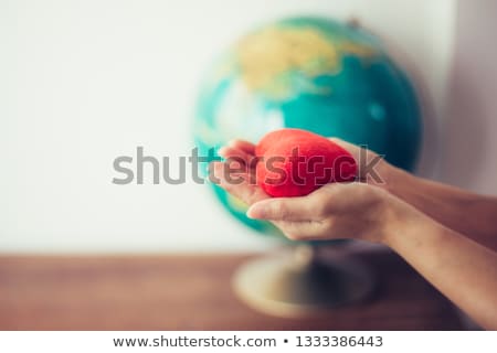 Foto d'archivio: Close Up Of Jesus Christ Holding Heart Shape