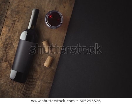 Foto d'archivio: Wine Bottles On Wood