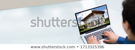 Stock fotó: Selecting New House On Laptop