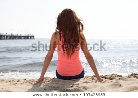 Stok fotoğraf: Back View Of Young Pretty Girl In White Swimsuit Sitting