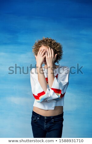 ストックフォト: Androgynous Man Covering His Face