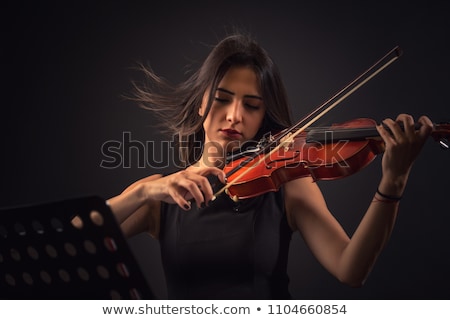 Stock photo: Passionate Violin Musician Playing On Black Background