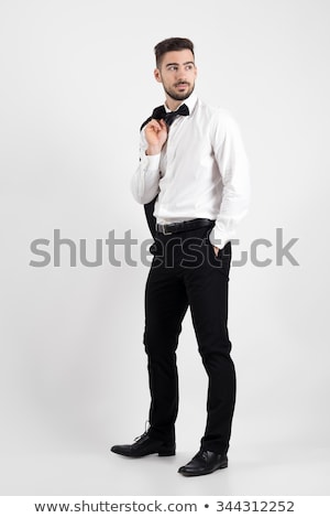 Stockfoto: Side View Of A Pensive Elegant Man In Tuxedo