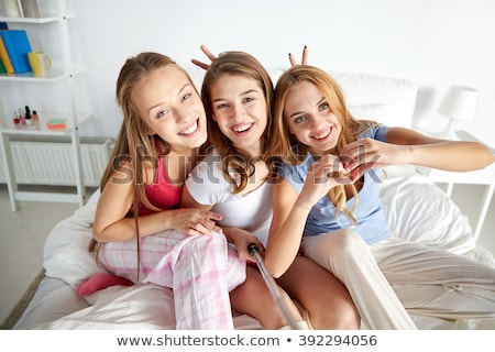 [[stock_photo]]: Friends Taking Picture By Selfie Stick At Home