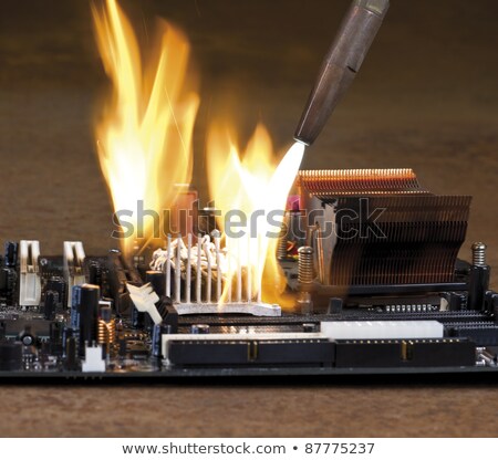 [[stock_photo]]: Burning A Computer Chip With Welding Torch