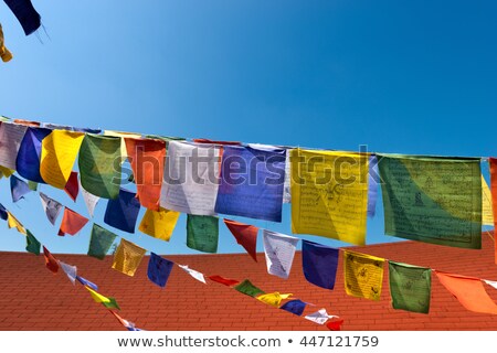 Foto stock: Buddhist Architecture Detail Roof And Prayng Flags In Tibet