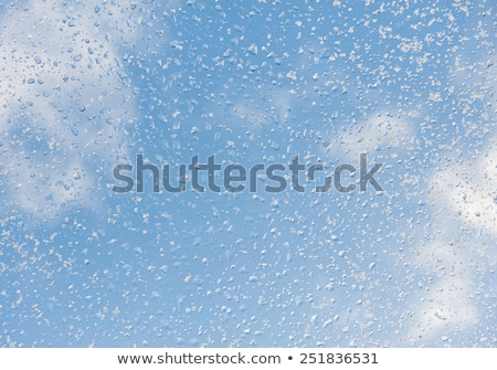 Foto stock: Frozen Water Drops And Sunlight On Winter Glass