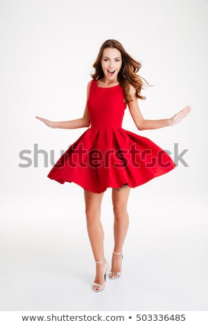 Foto stock: Young Woman In Red Santa Costume On White