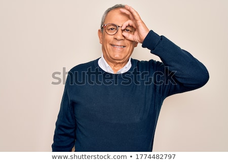 [[stock_photo]]: Senior Man Looking Through Binoculars