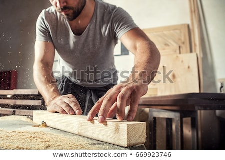 [[stock_photo]]: Carpenters Working With Wooden Board At Workshop