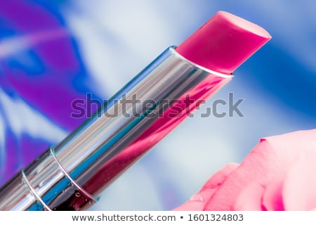 Stockfoto: Pink Lipstick And Rose Flower On Liquid Background Waterproof G