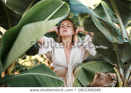[[stock_photo]]: Red Bikini Girl With Tropical Plants