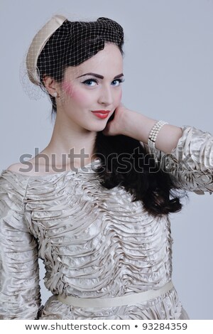 Beautiful Woman Wearing White Retro Dress Posing In Studio [[stock_photo]] © dotshock