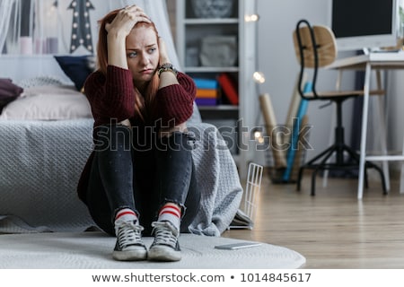 Foto d'archivio: Depressed Teenage Girl