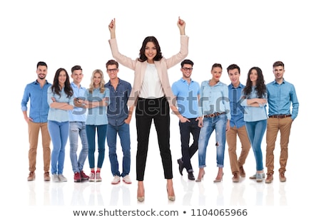 ストックフォト: Smiling Businesswoman Pointing In The Air In Front Of Her