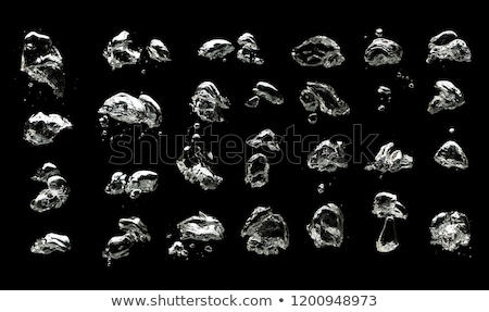 Foto d'archivio: The Shiny Drops Of Water On A Black Background