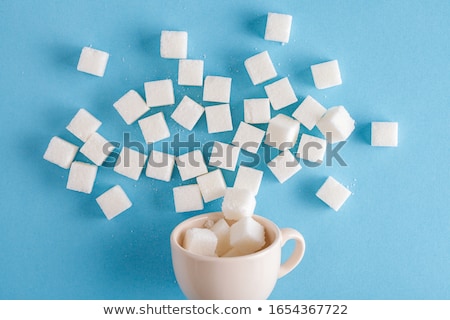 ストックフォト: Pile Of White Sugar Isolated On Blue Background
