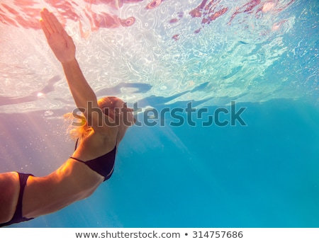 Stok fotoğraf: Young Woman By Swimming Pool Portrait