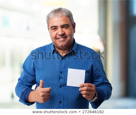 Сток-фото: Joyful Man Showing Empty White Card