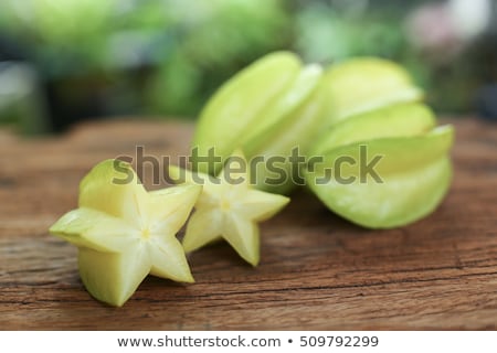 Stockfoto: Star Fruits On Wooden Table Thai Fruit Star Fruit Is Popular In Asia Sweet Taste Fruits Star Fr