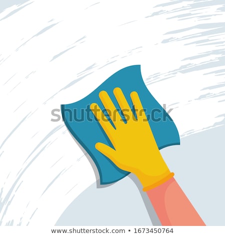 Foto d'archivio: Man Cleaning The Glass Office Desk With Rag