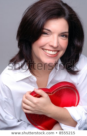 Stok fotoğraf: A Brunette Woman With A Heart Shaped Box