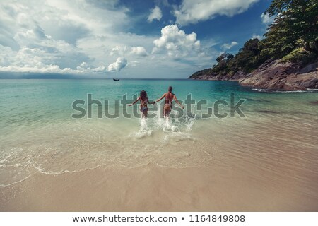 Stok fotoğraf: Couple Running In The Sea
