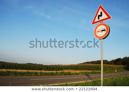 ストックフォト: Landscape With A Traffic Sign Dont Overtake