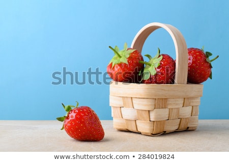 Basket Of Strawberries On The Table Surface Stock foto © Frannyanne