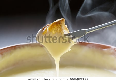 Сток-фото: Cooking Cheese Fondue