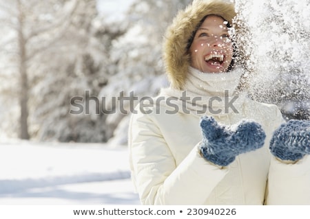 Foto stock: Woman Playing In The Snow