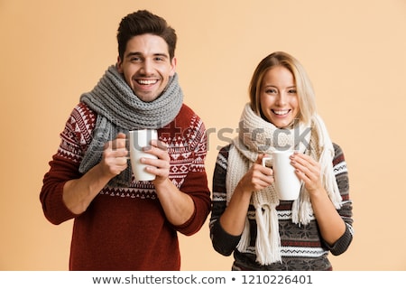 商業照片: Portrait Of A Happy Young Couple Dressed In Sweaters