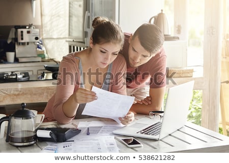 Stockfoto: Couple Calculating Invoice