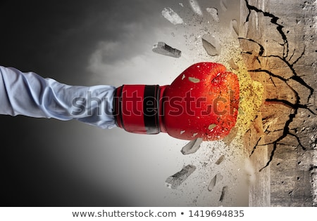 Stok fotoğraf: Hand Hits Intense And Breaks Stonewall