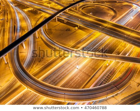 Stock photo: Taxi Cab Speeding Down A City Street At Night